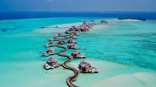 Maldives 4K  Beautiful relaxing music  surreal drone footage [upl. by Sisely]